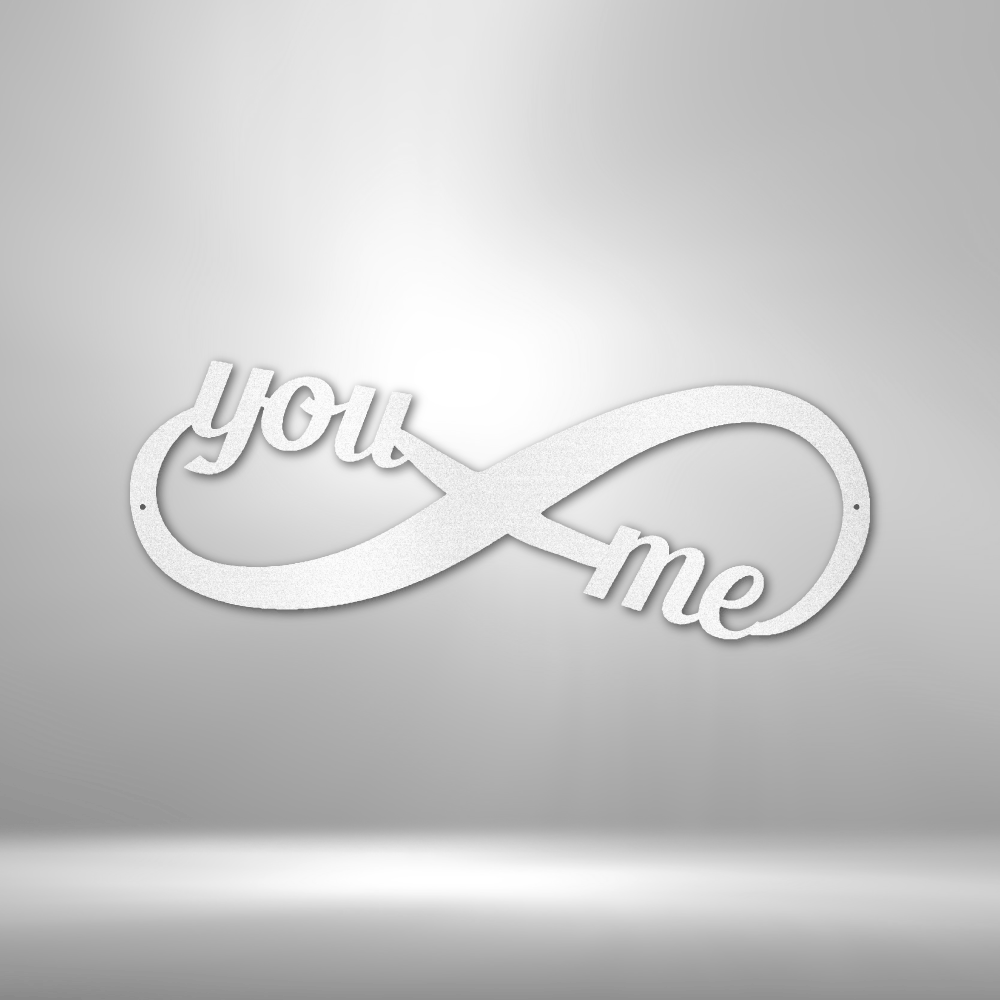 A Personalized Steel Monogram with the words you me on it.