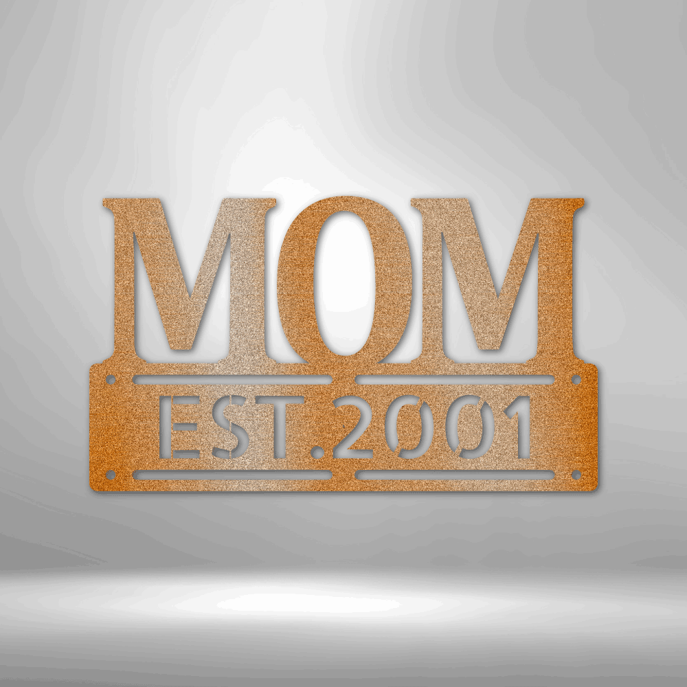 A UNIQUE Metal Wall Art Decor - Personalized Mother's Day Plaque with the word mom, hanging on a brick wall.