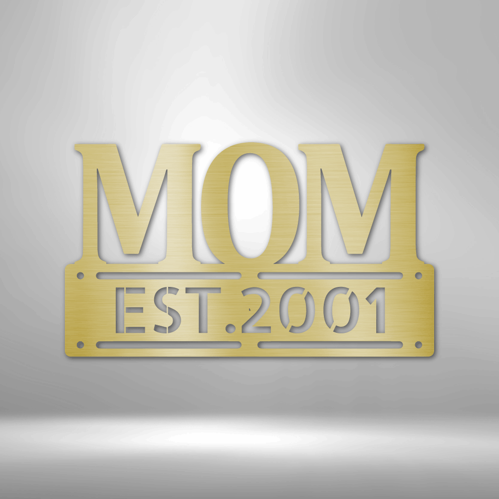 A UNIQUE Metal Wall Art Decor - Personalized Mother's Day Plaque with the word mom, hanging on a brick wall.