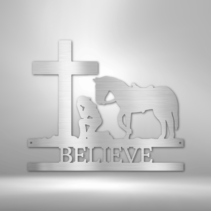 A unique custom handmade metal wall art decor featuring a kneeling cowgirl monogram with the word "believe".