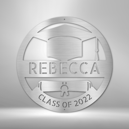 A durable outdoor metal sign with a custom handmade design of a grad cap monogram with the word Rebecca on it.