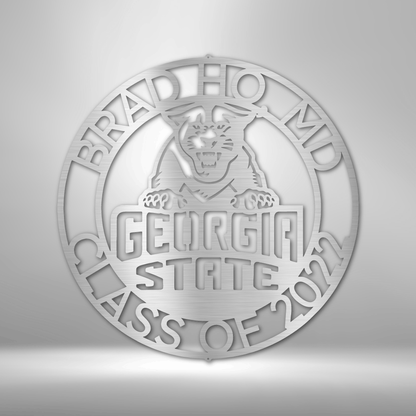 The personalized Georgia State Monogram 2 logo is a durable, custom handmade steel sign displayed on a brick wall.