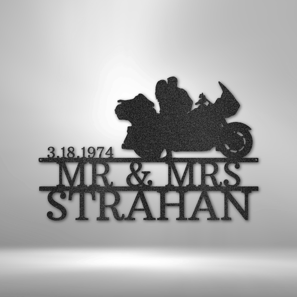 Mr and Mrs Strahan celebrate their anniversary with a personalized steel monogram garage sign.