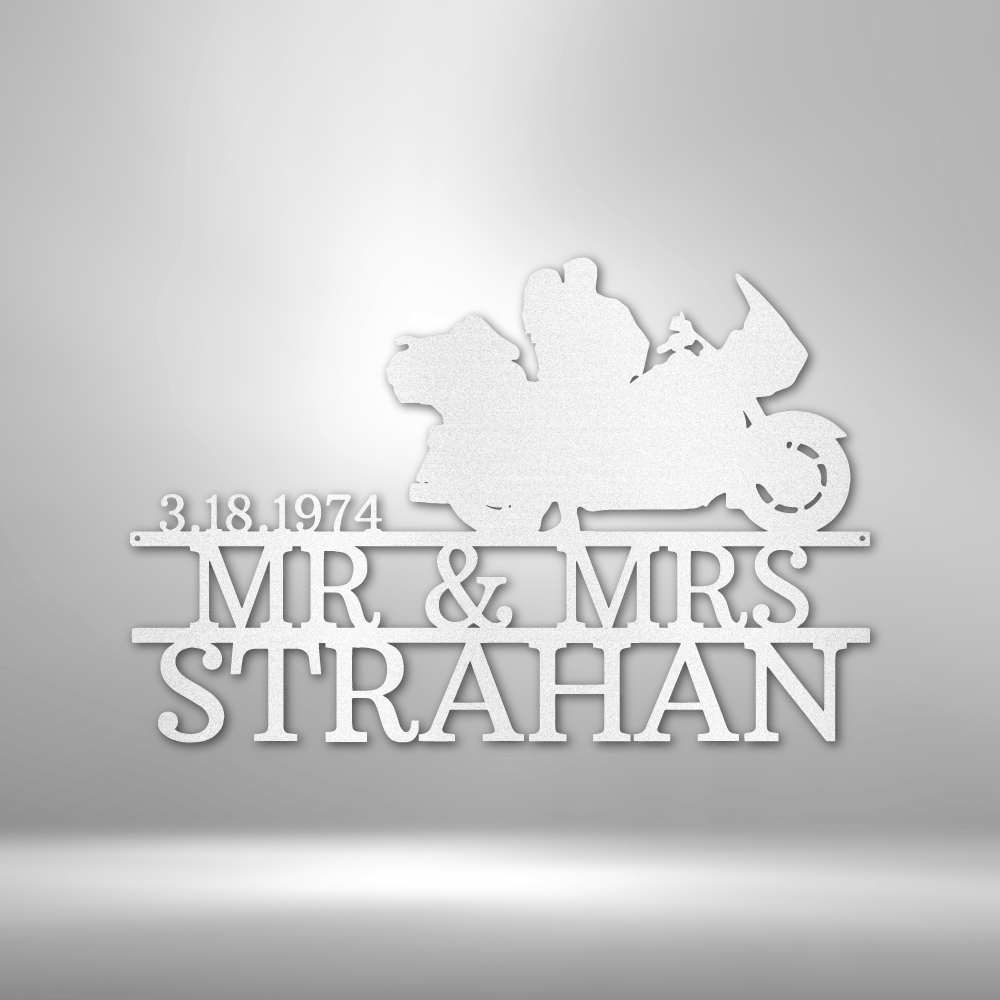 Mr and Mrs Strahan celebrate their anniversary with a personalized steel monogram garage sign.