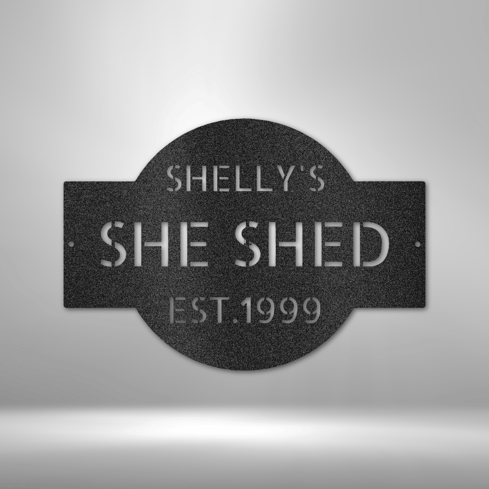 A PERSONALIZED Metal Wall Art Decor plaque that says she shed on a brick wall.