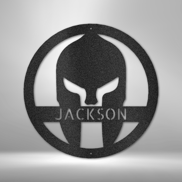 A Durable Outdoor Metal Sign featuring a Custom Handmade Design of a Spartan Helmet with the name Jackson on a brick wall.