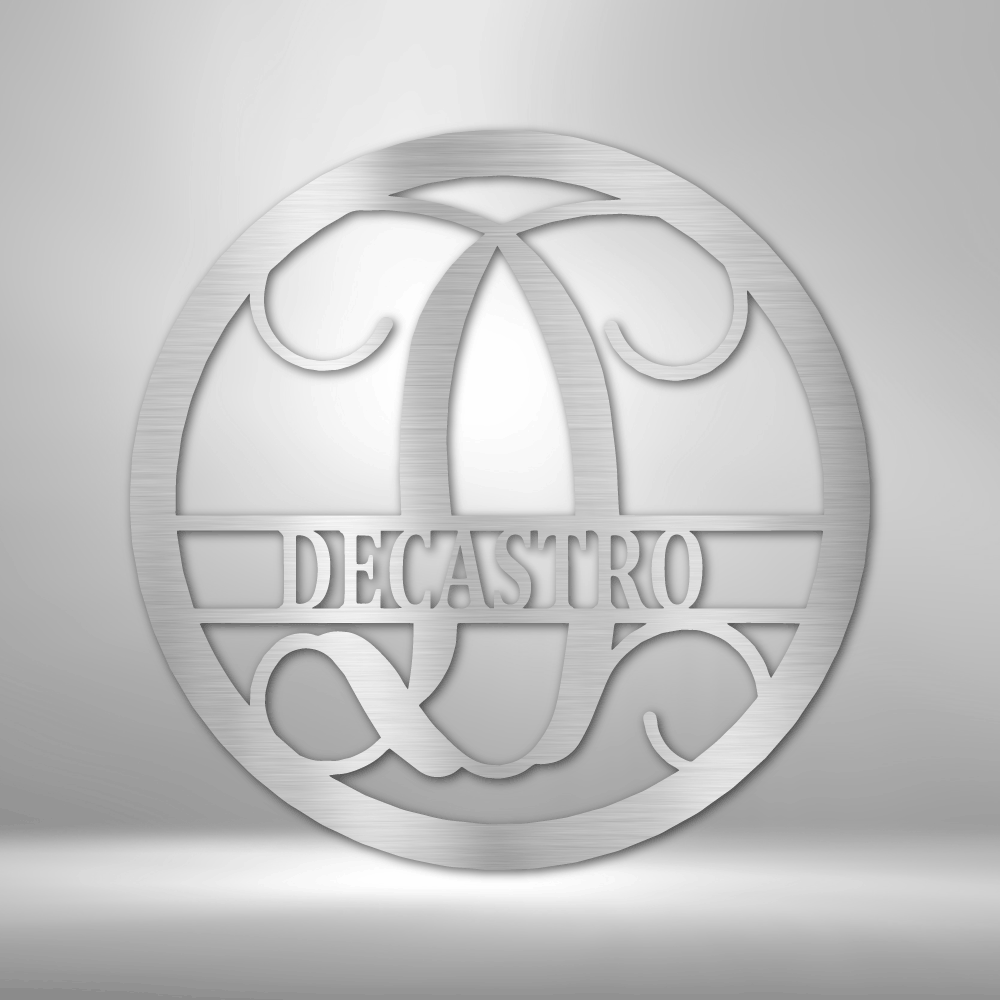 A PERSONALIZED Circle Vine Monogram - Steel Sign with the name decastro hanging on a brick wall as Metal Wall Art Decor