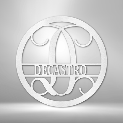 A PERSONALIZED Circle Vine Monogram - Steel Sign with the name decastro hanging on a brick wall as Metal Wall Art Decor