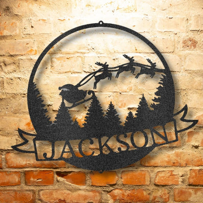 The Santa's Journey Monogram - Steel Sign showcases laser-cut artistry of Santa's sleigh and reindeer flying over pine trees, all powder-coated for durability. The piece is personalized with the name "Jackson," providing a unique addition to your holiday decor.