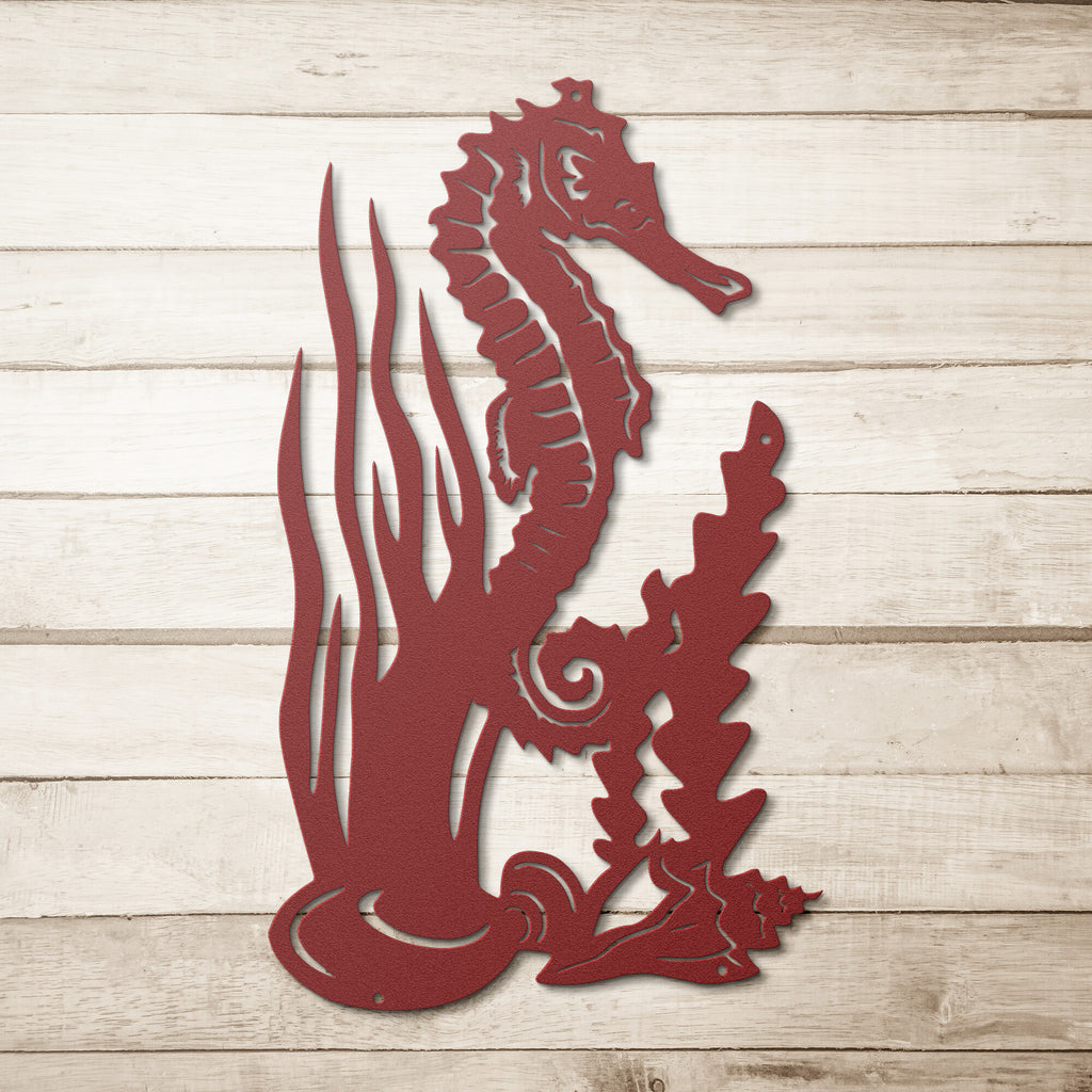 A unique red Seahorse Steel Monogram Home Wall Art Decor on a durable wooden background.