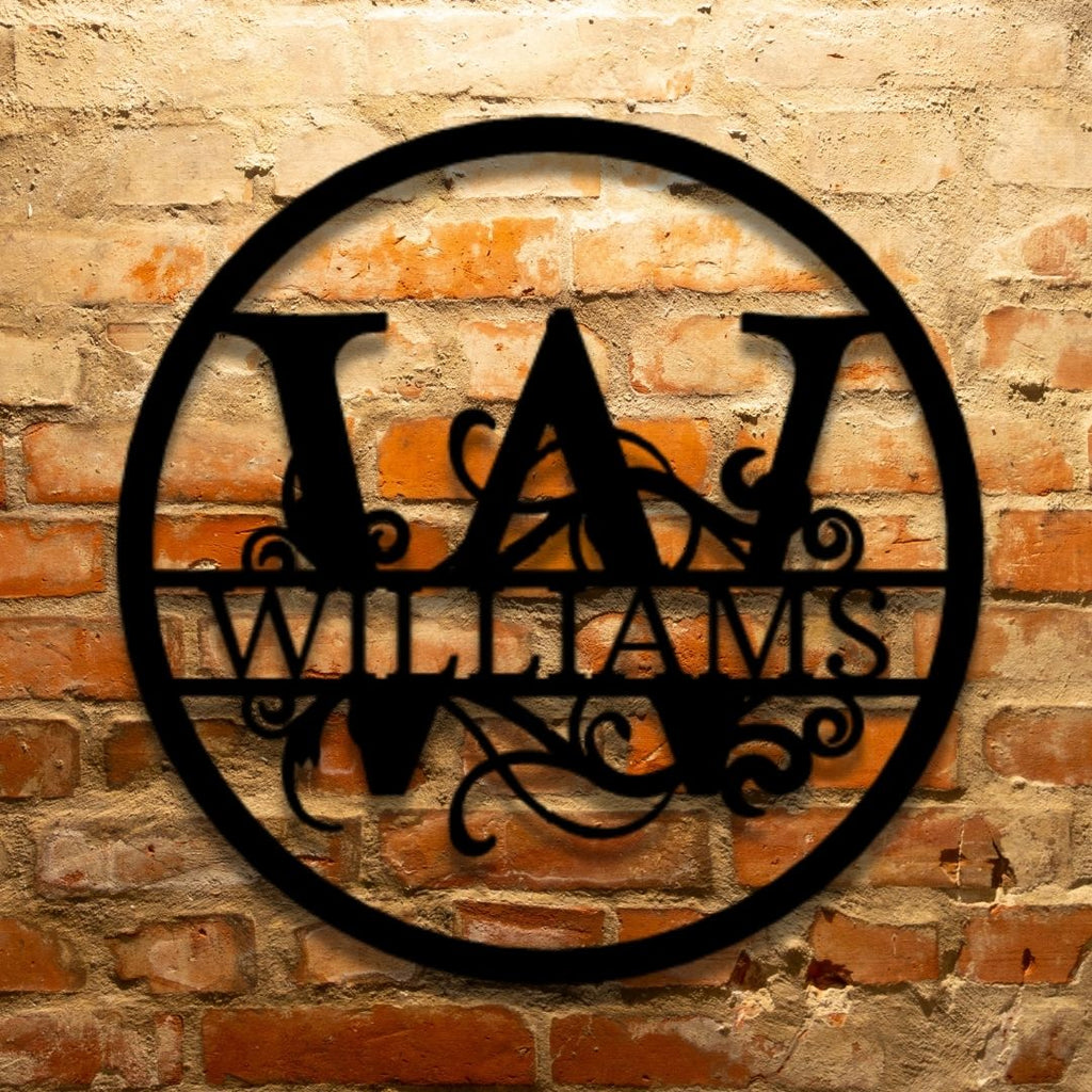 The Split Circle Monogram - Durable Outdoor Metal Sign on a brick wall.