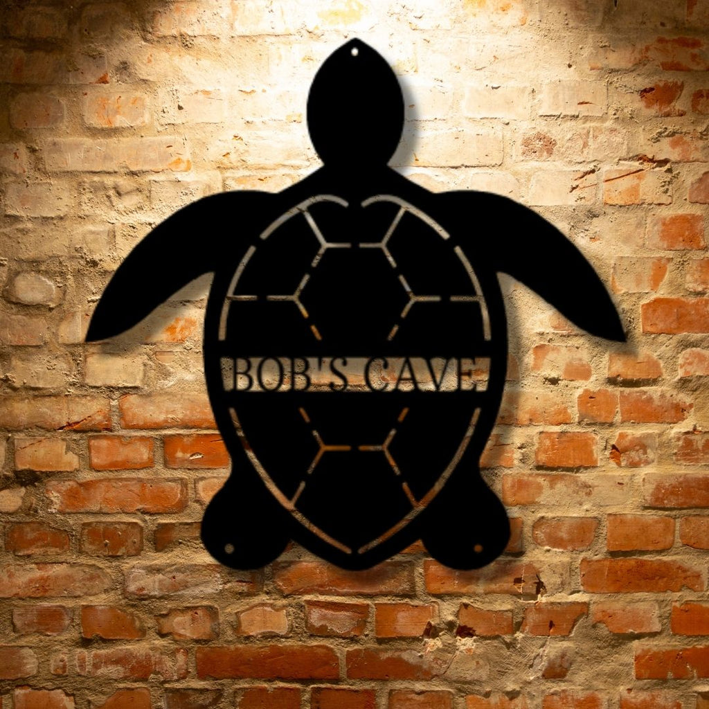 A durable outdoor metal sign featuring a custom handmade design of a black Turtle Monogram displayed on a brick wall.
