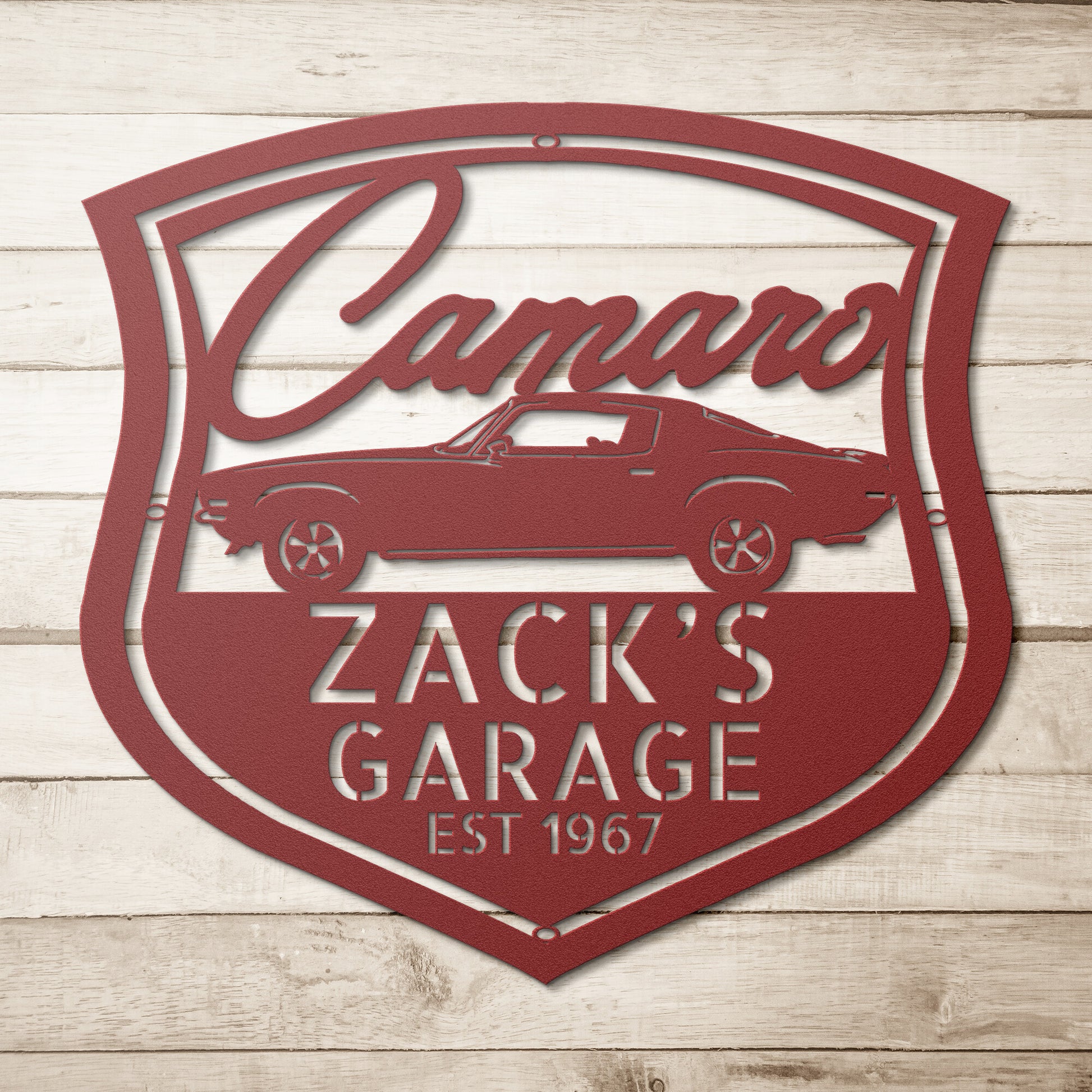 A personalized vintage car metal sign featuring a Chevrolet Camaro 1970 logo on a brick wall.