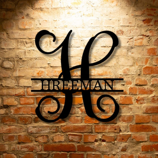 Custom Handmade Metal Wall Art Decor: The Vine Family Monogram - Steel Sign on a brick wall.