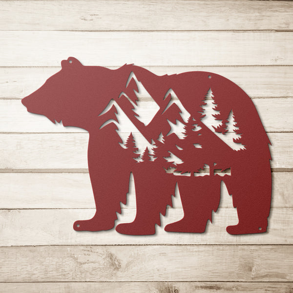A custom BEAR MONOGRAM sign made of steel, featuring a bear in the forest surrounded by trees and mountains on a white background.