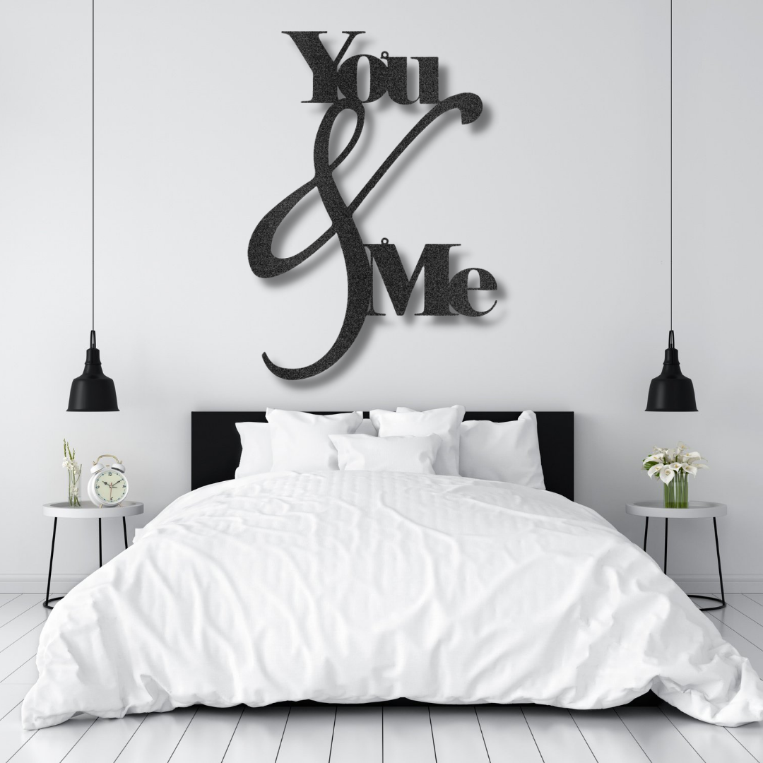 Metal Wall Art Decor - You and Me Quote on a steel sign displayed on a brick wall.