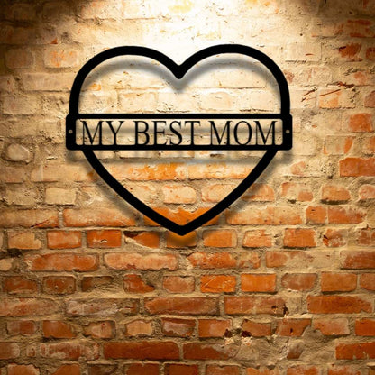 A personalized steel monogram that says "my best mom" on a brick wall.