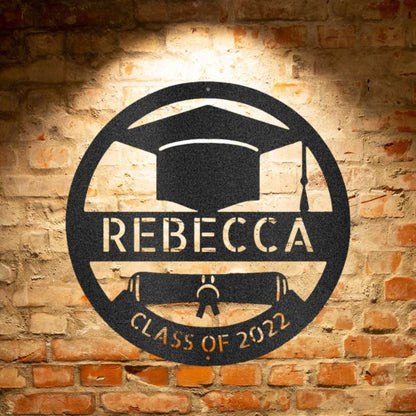 A durable outdoor metal sign with a custom handmade design of a grad cap monogram with the word Rebecca on it.