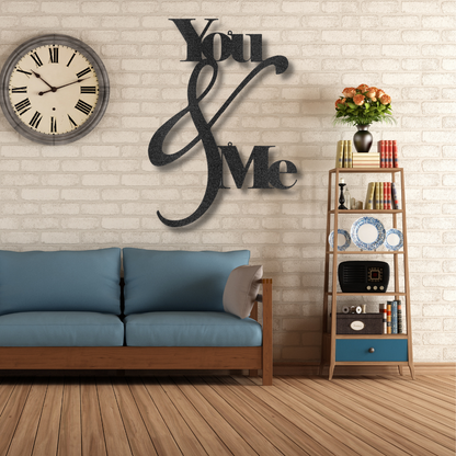 Metal Wall Art Decor - You and Me Quote on a steel sign displayed on a brick wall.